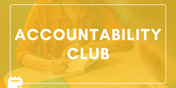 Assistants sitting across from each other at a table while they work to complete their tasks.