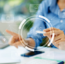 An administrative professional using a stylus on a holographic screen to work with AI representing the future of the role.